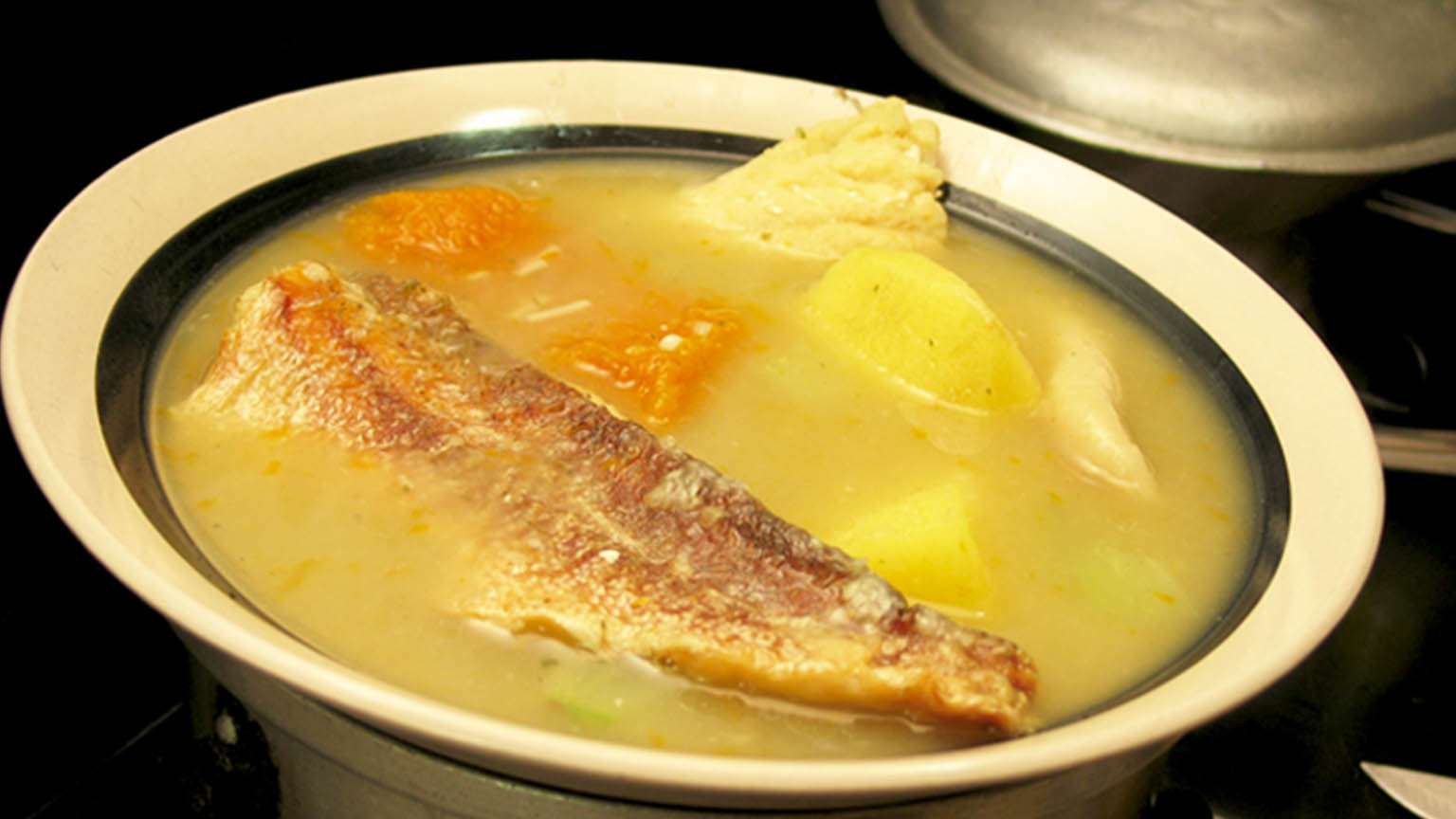 https://jamaicandinners.com/wp-content/uploads/2021/10/Fish-Tea-Soup-Jamaican-Soup-Food-Recipe-MiQuel-Marvin-Samuels-1.jpg